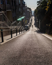 Early morning scene of an endless downhill street in the gràcia district in barcelona, spain. 