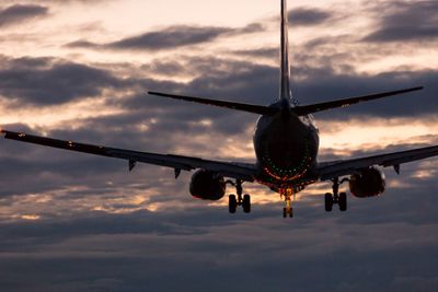 Low angle view of airplane flying in sky