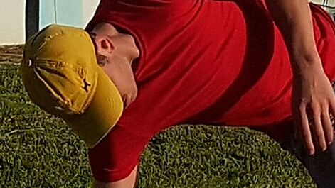 Close-up of man with red umbrella