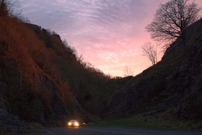 Scenic view of cheddar gorge against sky during sunset