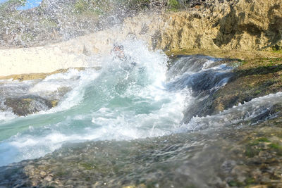 Waves splashing on rocks