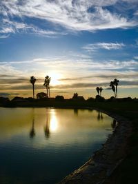 Reflection of clouds in water at sunset