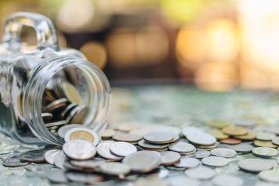 Close-up of coins on table