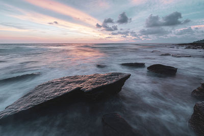 Scenic view of sea against sky during sunset