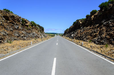 Empty road against clear sky