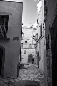 Narrow alley amidst buildings in city