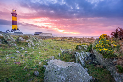 Scenic view of land against sky during sunset