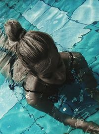 High angle view of girl swimming in pool