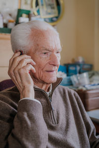 Portrait of man sitting at home