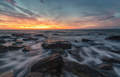 Scenic view of sea against sky during sunset