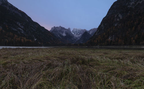 Scenic view of lake and mountains against sky