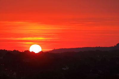 Scenic view of silhouette landscape against romantic sky at sunset