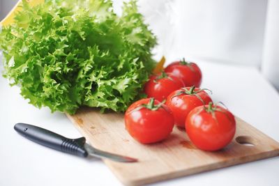 Close-up of tomatoes on cutting board