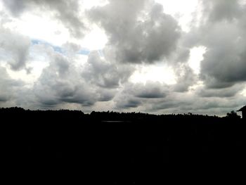 Silhouette landscape against sky