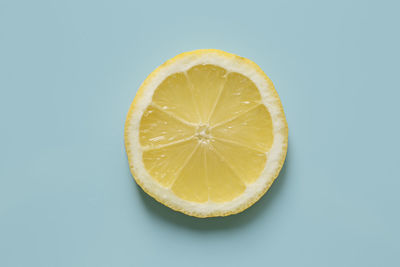 Close-up of lemon slice against white background