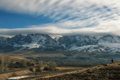 View of landscape against cloudy sky