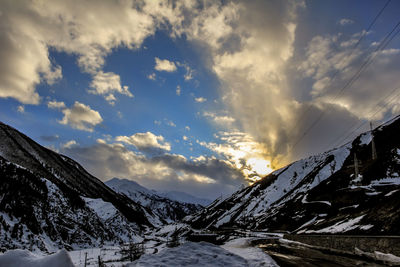 View of snow covered mountain against cloudy sky