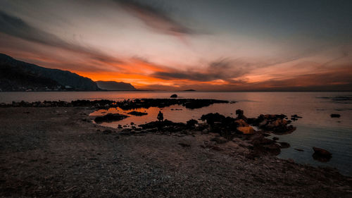 Scenic view of sea against sky during sunset