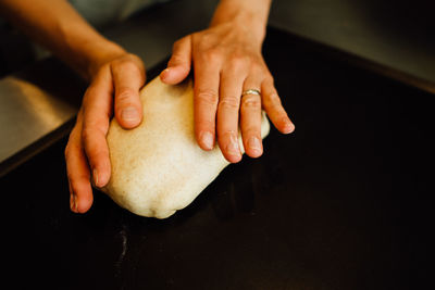 Process of preparing dough for bread, crop on hands