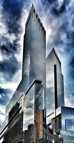 Low angle view of building against cloudy sky