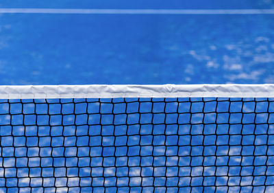 Close-up of swimming pool against blue sky