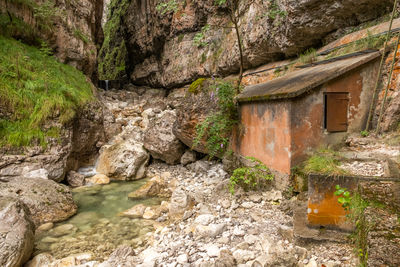 View of stream flowing through rocks