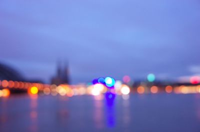 Defocused image of illuminated city at night