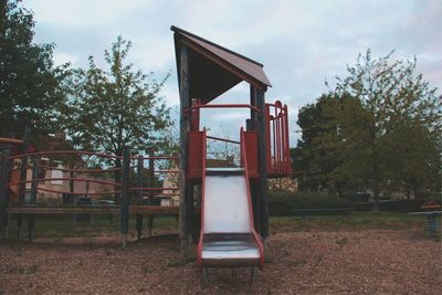 View of playground against sky in park