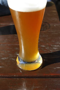 Close-up of beer glass on table