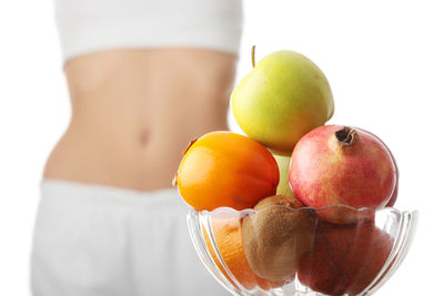 Close-up of apples in spring against white background