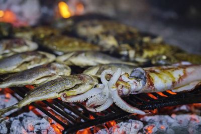 Close-up of fish on barbecue grill