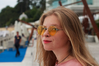 Close-up of young woman wearing sunglasses