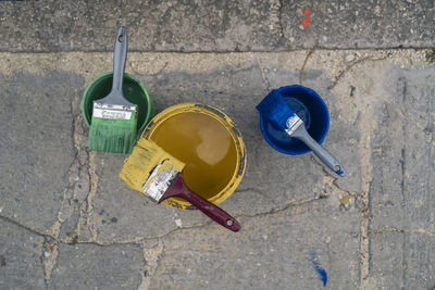 High angle view of garbage can on footpath