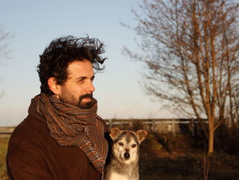 Portrait of young man with dog