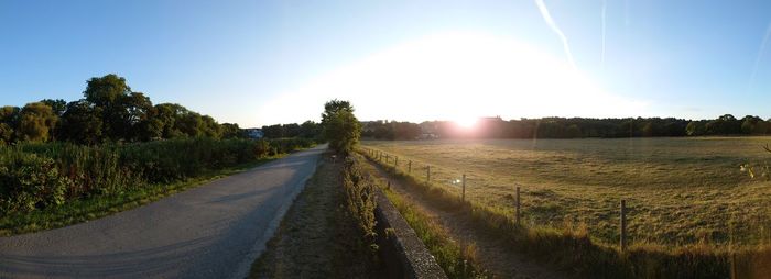 Empty road along countryside landscape