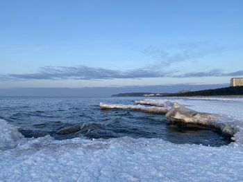Scenic view of sea against sky during winter