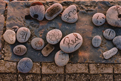 High angle view of text on old stone wall