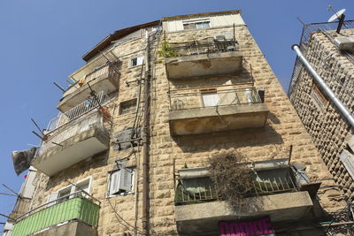 Low angle view of old building against sky