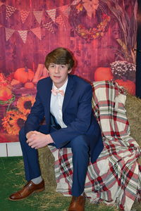 Young man sitting on seat