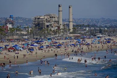 Lots of people enjoying a summer day at huntington beach, california.