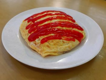 Close-up of breakfast served in plate on table