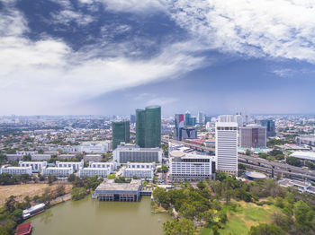 Cityscape against cloudy sky