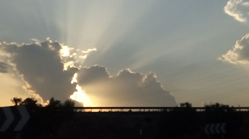 Low angle view of silhouette bridge against sky during sunset