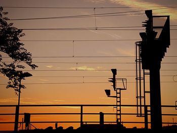 Low angle view of electricity pylon against sky