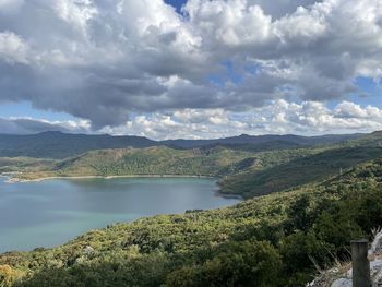 Scenic view of lake and mountains against sky