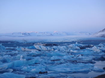 Scenic view of snowcapped landscape against sky