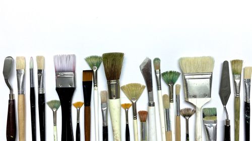 Row of chairs against white background