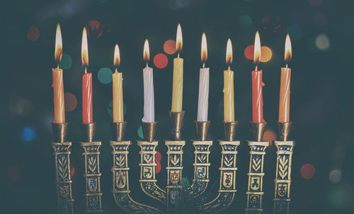 Close-up of illuminated candles on menorah