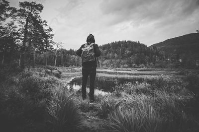 People standing on grassy field