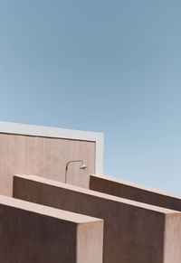 Low angle view of building against clear blue sky